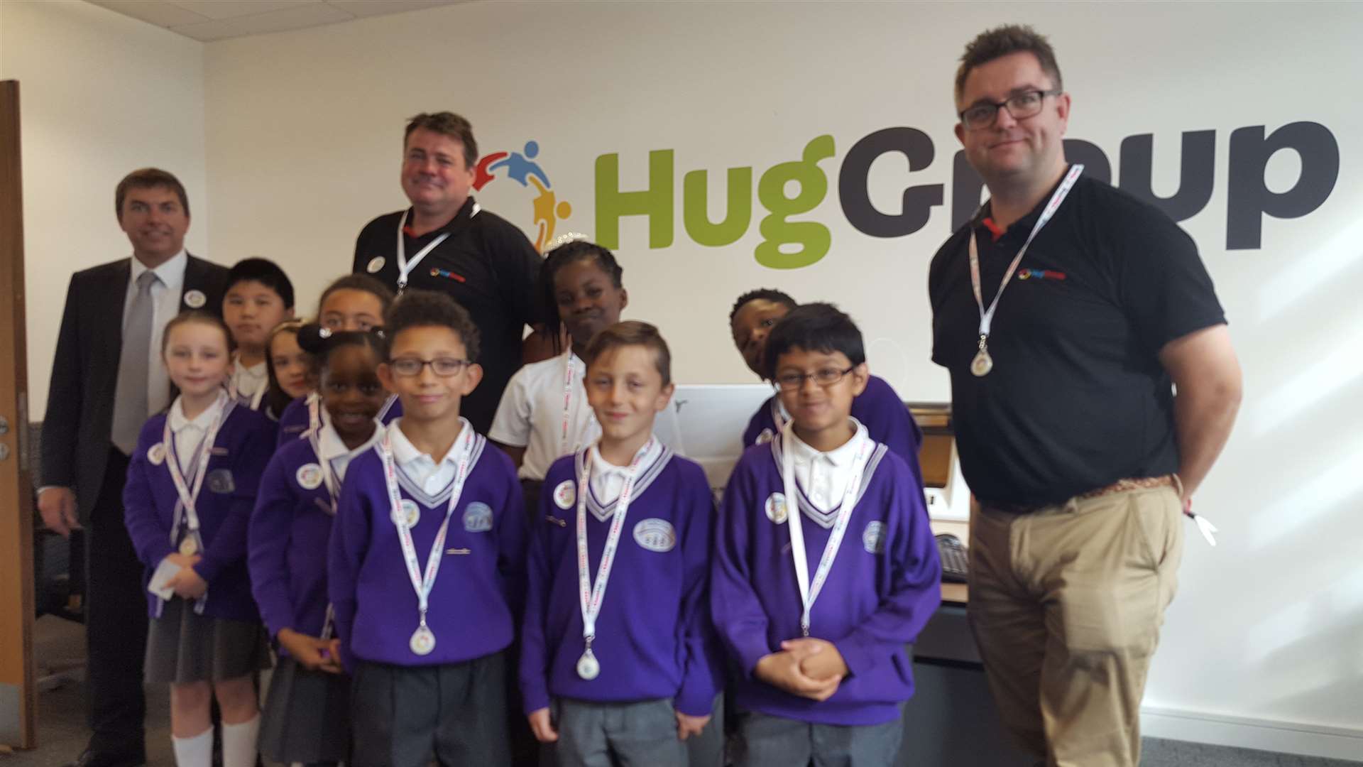 Pupils from Dartford Bridge Community Primary School with Dartford MP Gareth Johnson, left, and Hug Group founders Nick Charge, middle, and Andy Davies