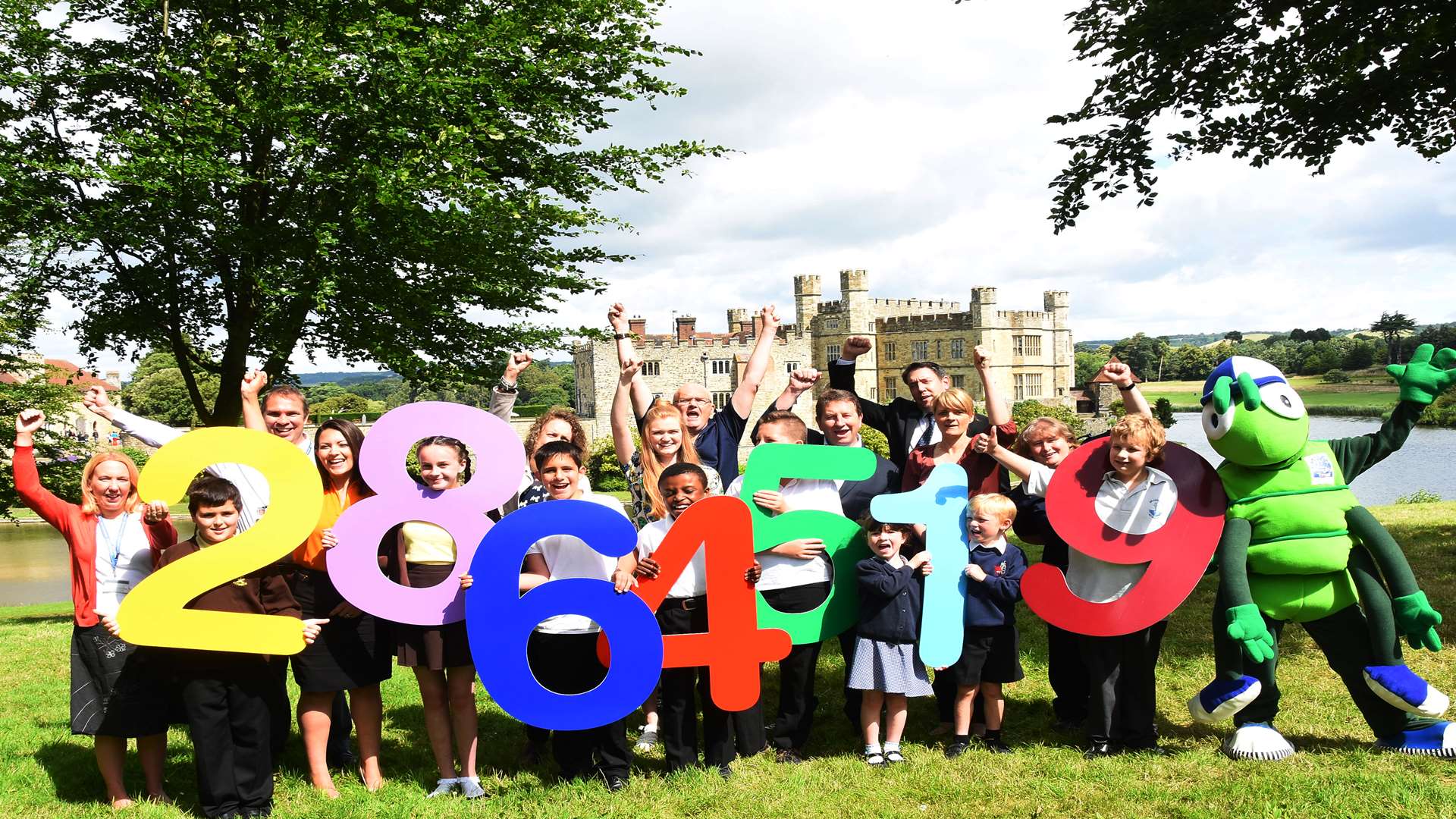 Buster's Book Club pupils and key partners celebrate a huge 2,864,519 minutes of home reading for the 2015-2016 academic year at the Summer Challenge Day event staged at Leeds Castle