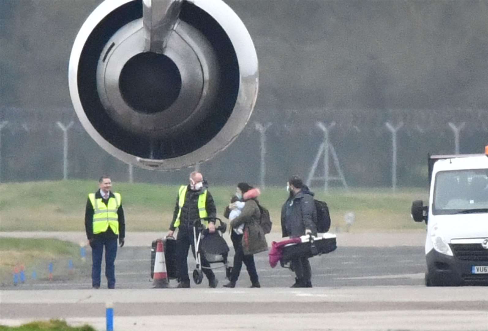 Passengers from a plane carrying British nationals from the coronavirus-hit city of Wuhan in China leave the aircraft after it landed at RAF Brize Norton in Oxfordshire in late January 2020 (Ben Birchall/PA)