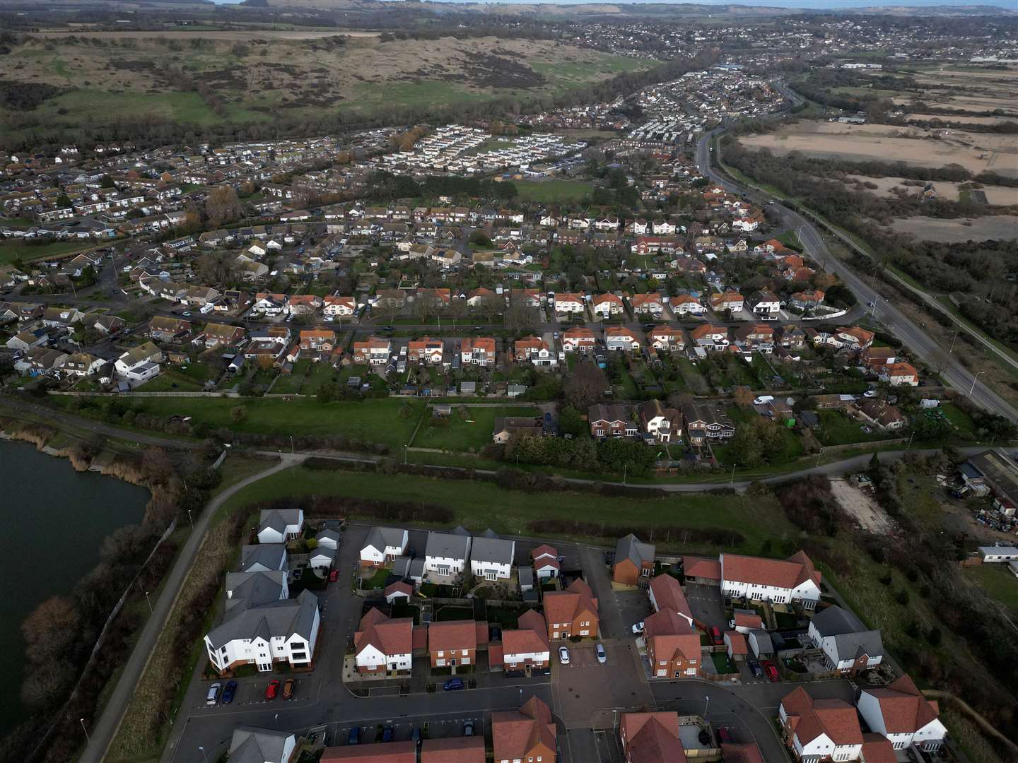The Barratt Homes development Martello Lakes can be seen at the bottom of this picture, backing onto older homes in Palmarsh, near Hythe. Picture: Barry Goodwin