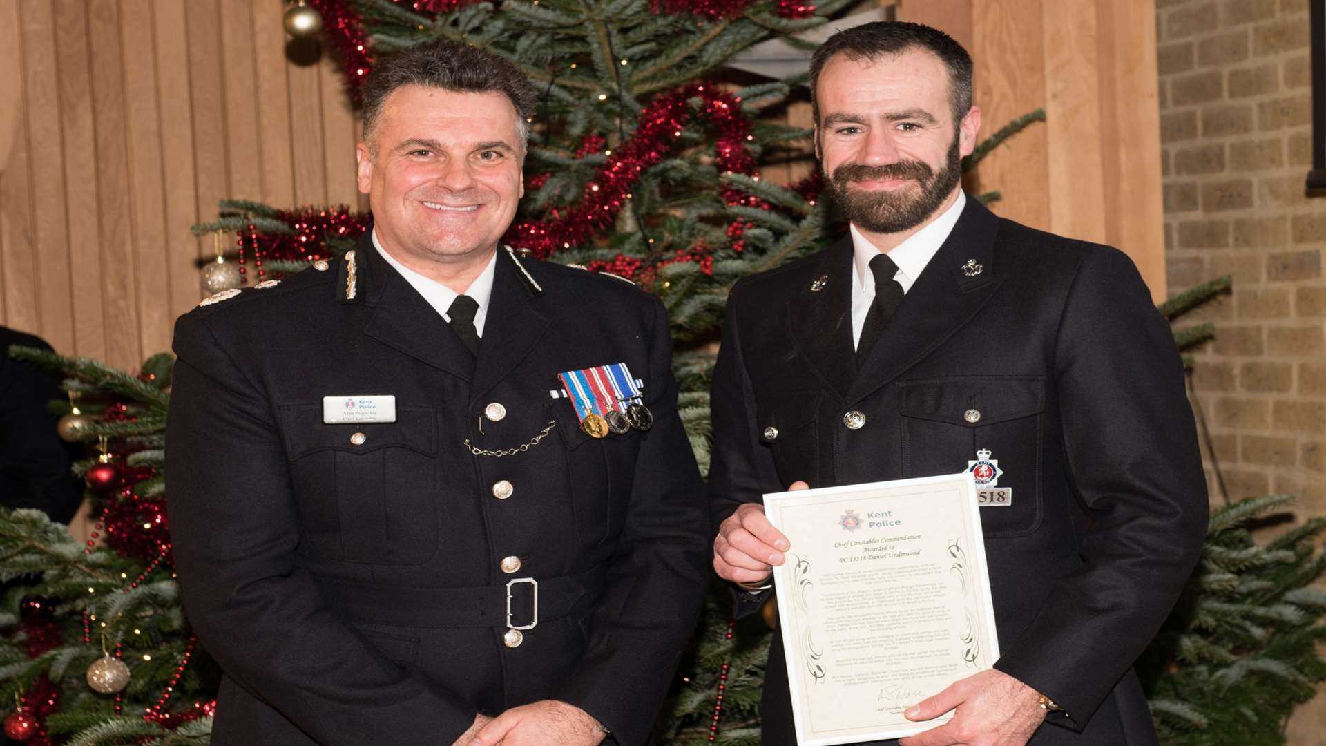 PC Daniel Underwood is awarded for his bravery by Chief Constable Alan Pughsley.