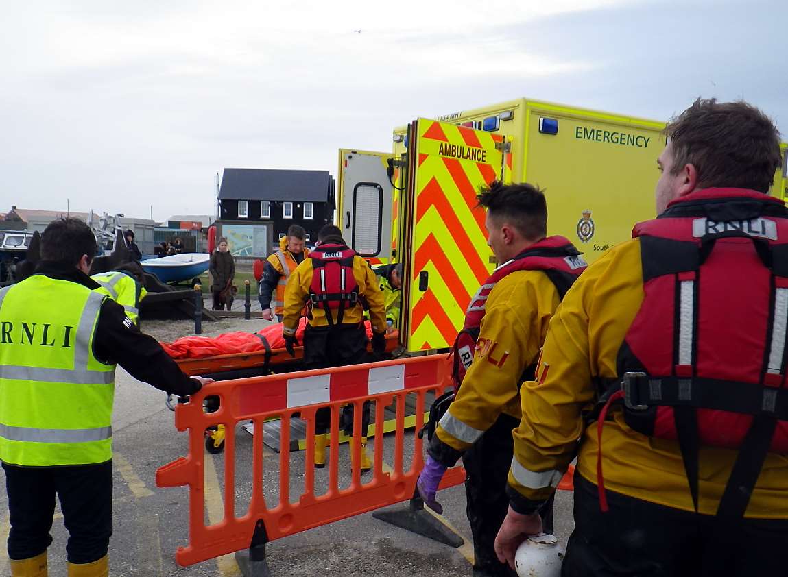 The injured man is taken to the ambulance. Picture: Whitstable Lifeboat