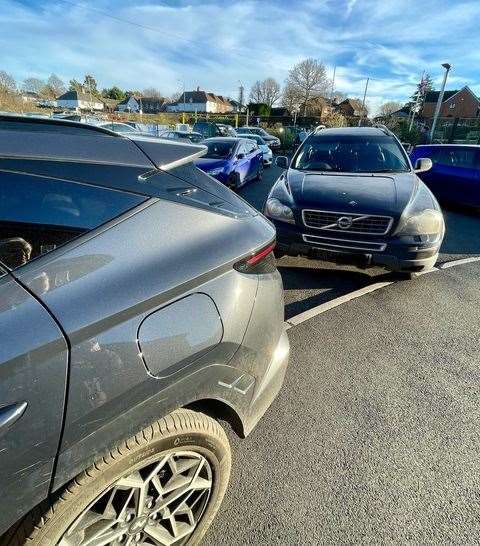 The charging policy has resulted in "parking chaos" at the school