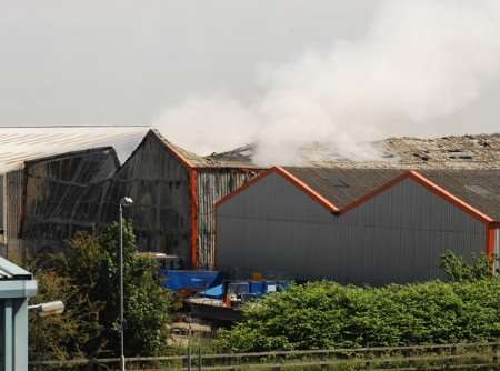 Smoke still coming out of the warehouse on Thursday. Picture: Nick Johnson