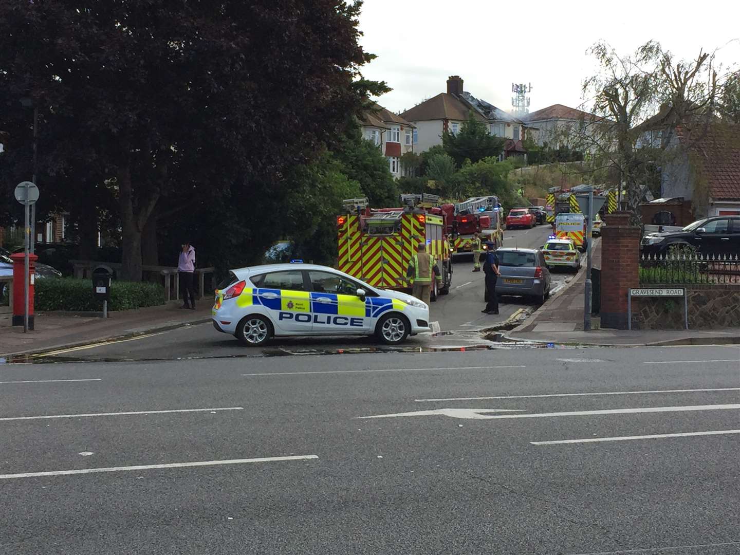 Firefighters and police at the scene of the fire in Broom Hill Road, Strood. Pictures: Brad Harper