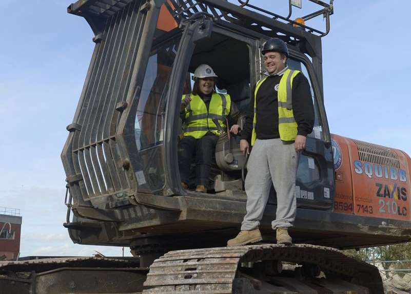 Hands on: Cllr Jane Chitty at the controls of a digger