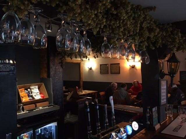 As traditional as it’s possible to be, there are always hops hanging above the bar