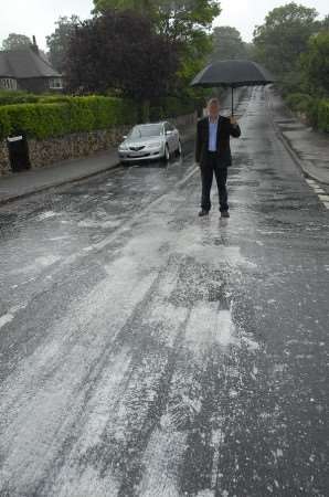 Colin Moull with paint on the road caused by vandals. Picture: Barry Duffield.