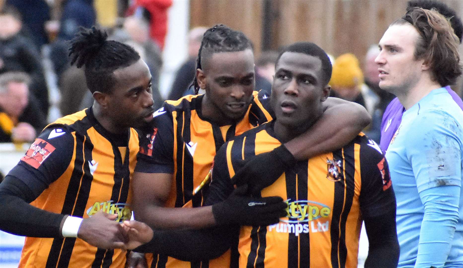 Folkestone striker Ade Yusuff celebrates with Ira Jackson and Ibrahim Olutade after scoring in their weekend 2-1 home loss to Hornchurch. Picture: Randolph File