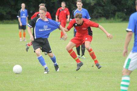 Footballers fromCoxheath B (in blue and black) and Fleet Leisure (in red) play in a charity match that descended into a brawl
