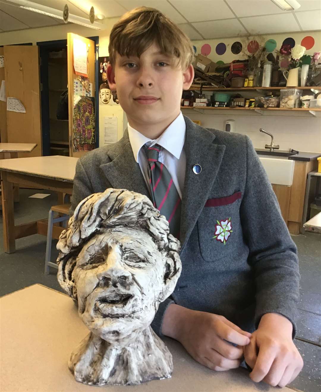 Seb Ford, 12, with his work