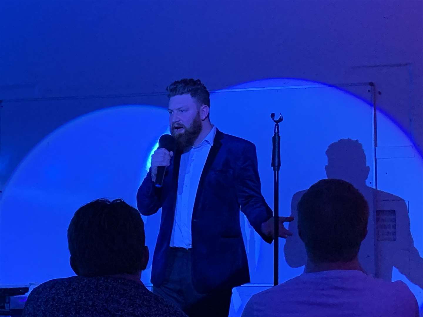 Comedian Sam Wyatt performing at a Much Laughter CIC comedy night held at Fort Luton
