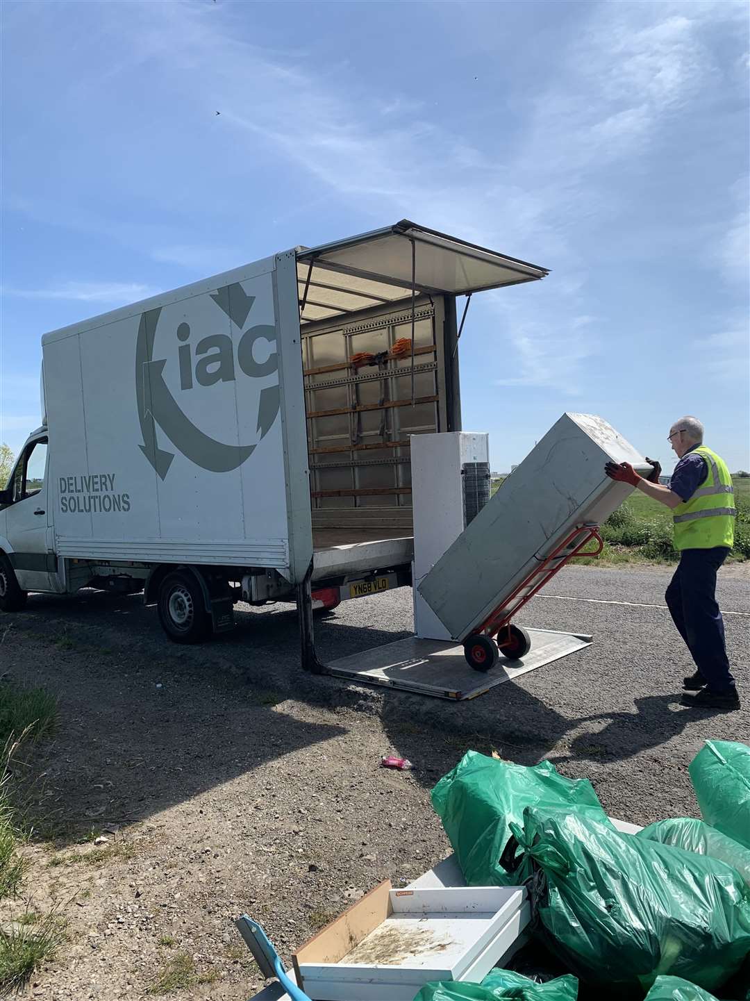 Loading up: fridges fly-tipped at Iwade taken away by Sittingbourne company IAC Delivery Solutions. Picture: IAC