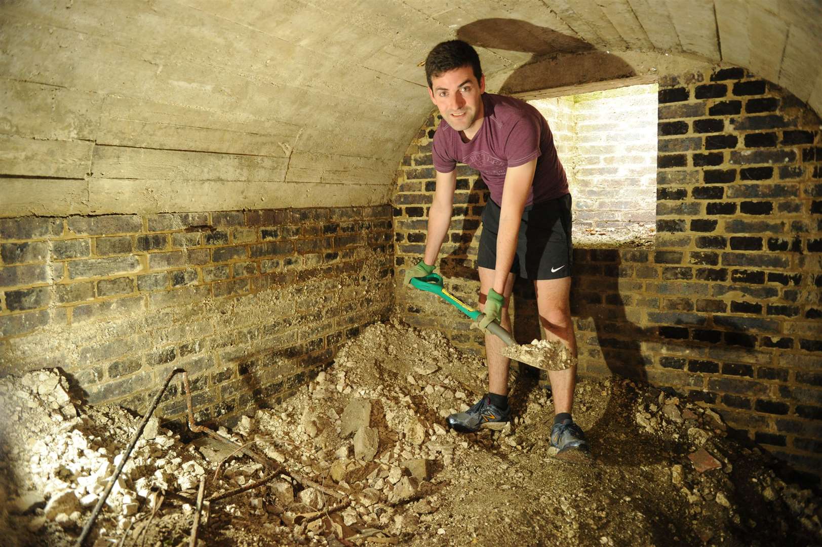Hugo Lesourd working in the air raid shelter found in his Rochester garden