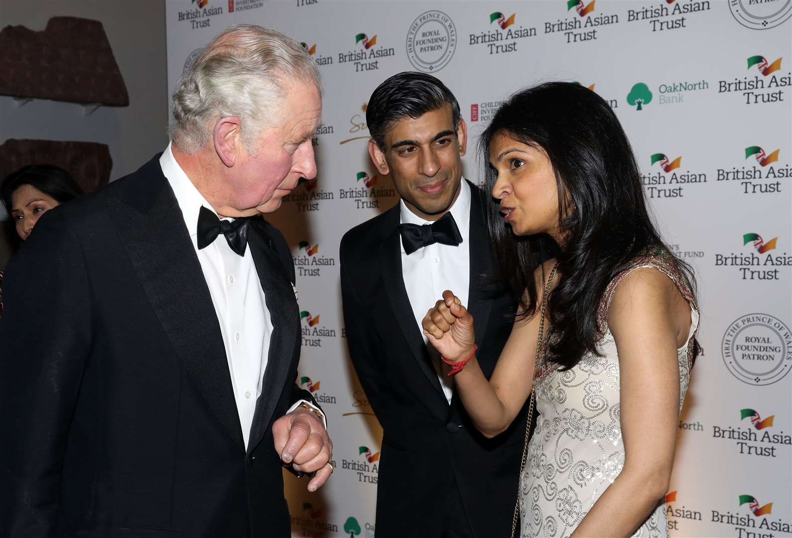 The Prince of Wales speaks to Chancellor Rishi Sunak and his wife, Akshata Murthy, at the British Asian Trust reception on Wednesday (Tristan FewingsPA)