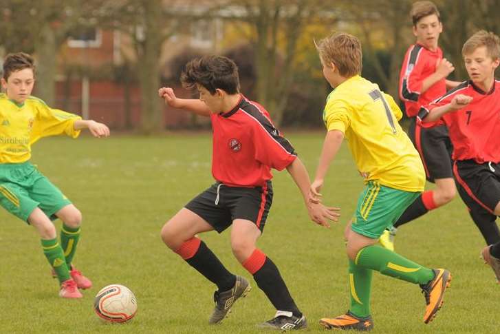 Rainham Kenilworth (red) and Woodcoombe Youth go head-to-head in Under-13 Division 3 Picture: Steve Crispe