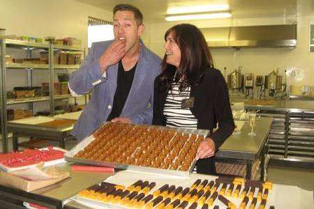 Richard Phillips with Sian Holt, founder of Fudge Kitchen, after opening new factory in Aylesham