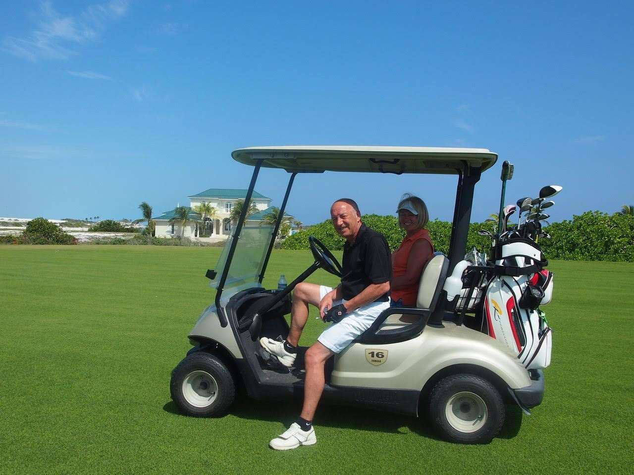 Allan Jordan and his wife Sharon in a golf buggy
