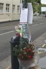 Floral tributes and messages left at the scene of the tragedy