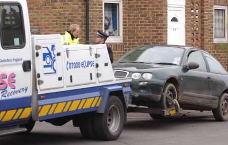 Police tow the car of a 19-year-old driver, caught reversing round a corner at speed on a pavement. Picture: DAVE DOWNEY