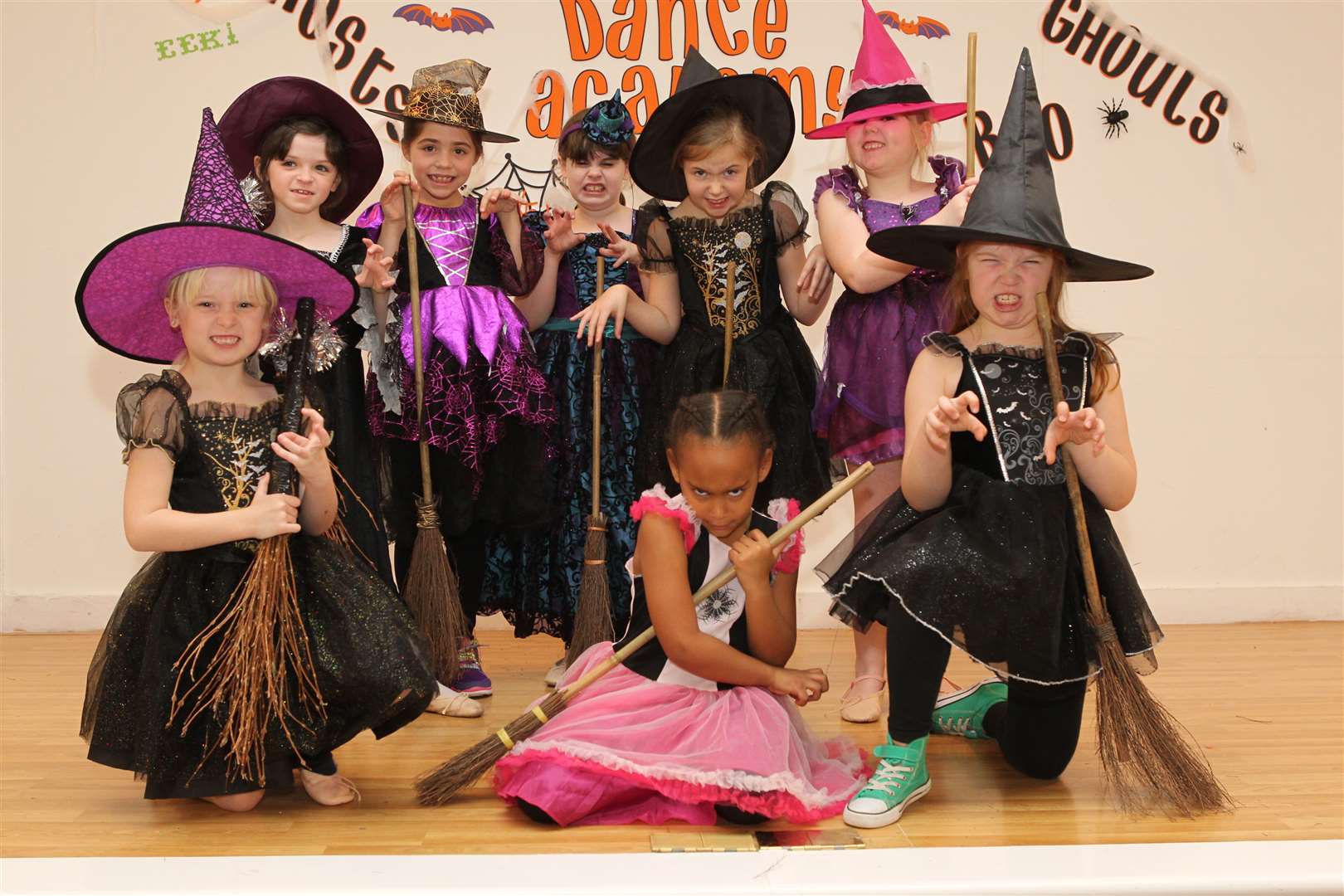 Youngsters dressed as witches at the spooky-themed Katie Jane Dance Academy Christmas show.
