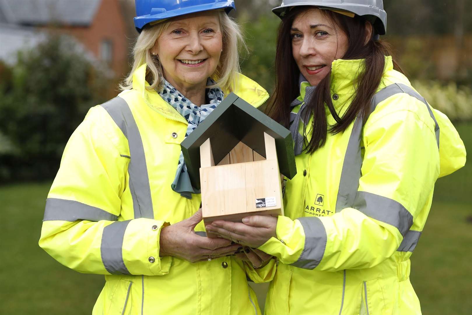 Barratt staff with one of the nest boxes fitted (1393378)