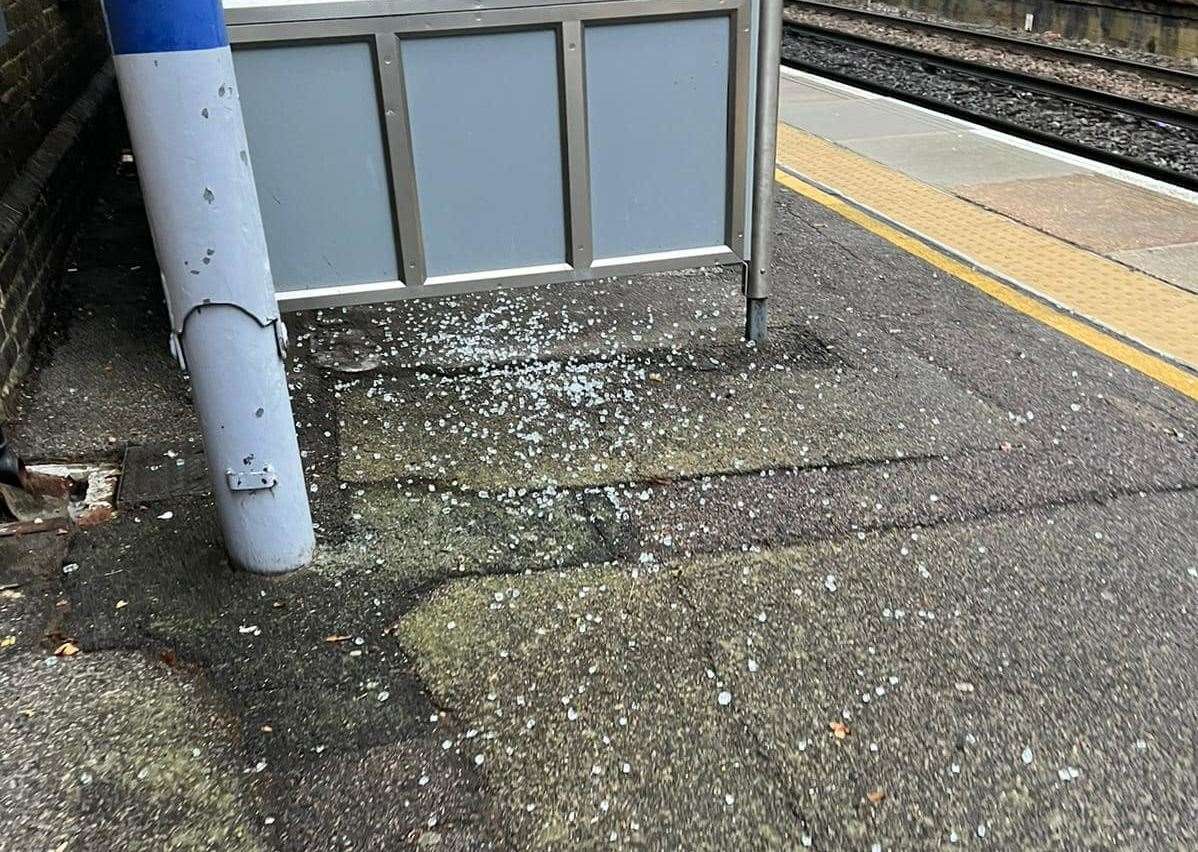 Glass from the smashed window is on the floor