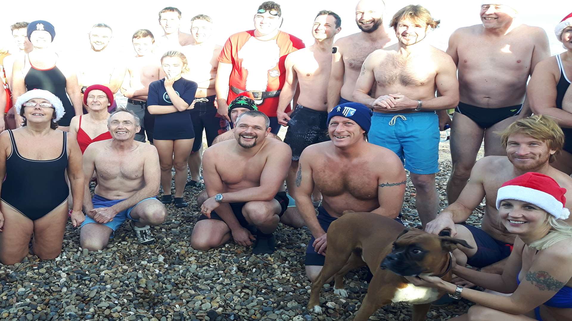 Brave swimmers on the beach at Sheppey