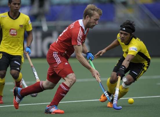 Barry Middleton in action for England against Malaysia at the World Cup Picture: Ady Kerry / England Hockey