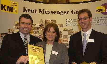 CONGRATULATIONS: Carolyn Thomas with Kentish Gazette editor Bob Bounds, left, and Mike Whiting, the KM Group's managing editor. Picture: JOHN WARDLEY
