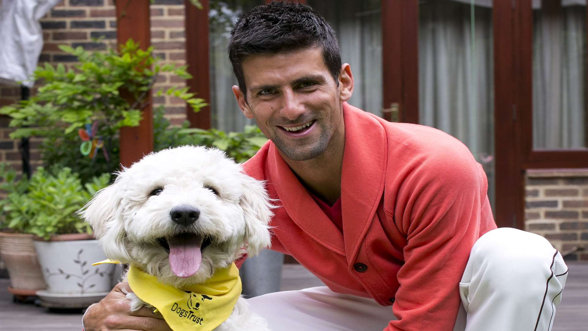Bella with new-found friend, tennis ace Novak Djokovic