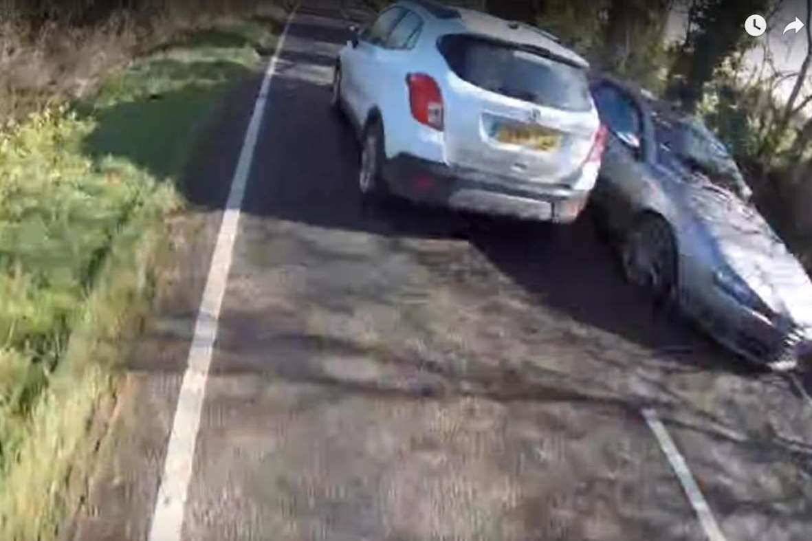 The overtaking car narrowly missed the oncoming car.