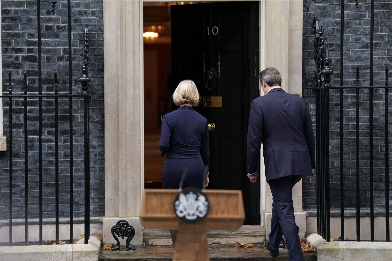 Liz Truss, with her husband Hugh O’Leary, walks back into 10 Downing Street (Kirsty O’Connor/PA)