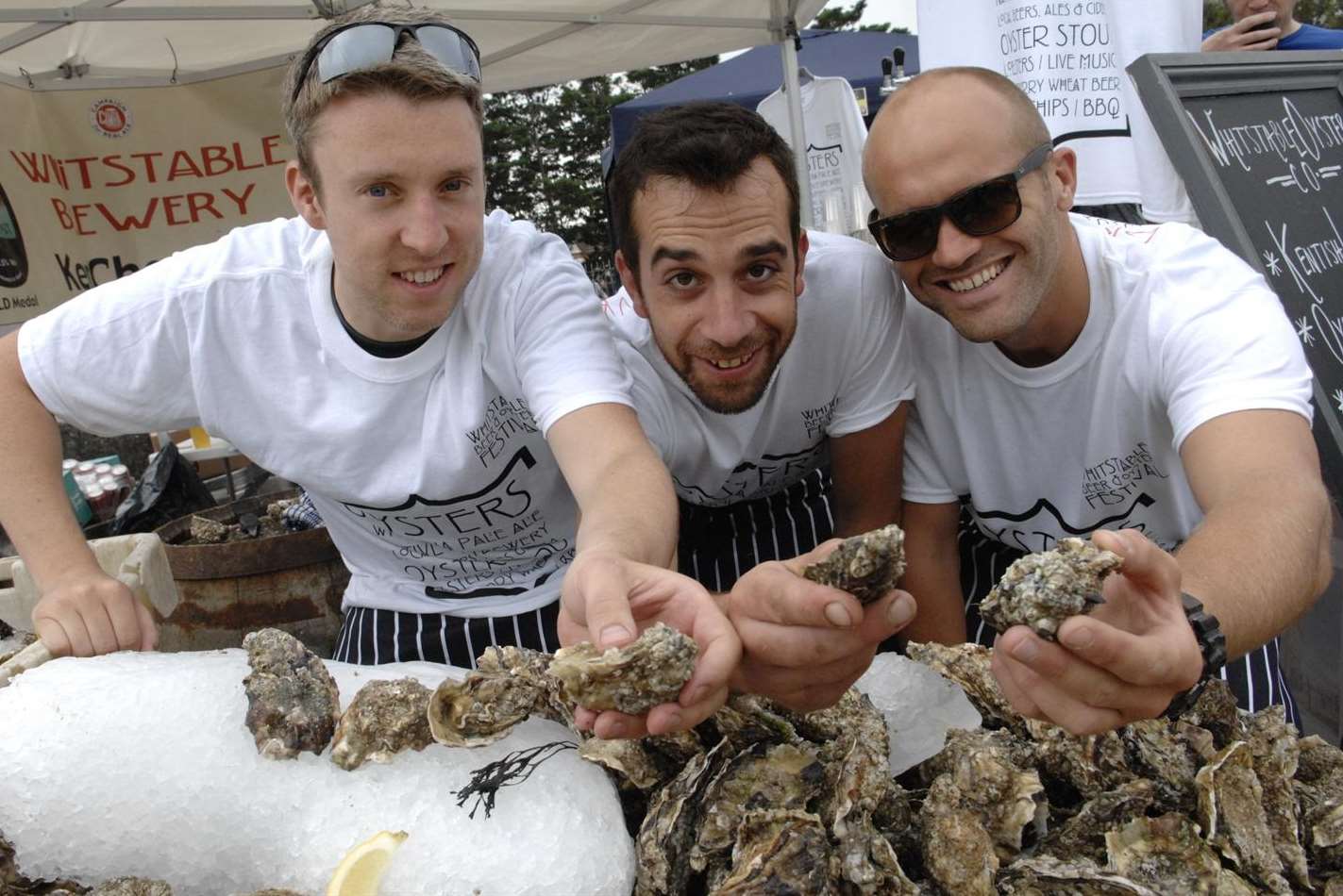Christopher Fleming, David Knight and James Day with a mountain of oysters at the Brewery Bar stall