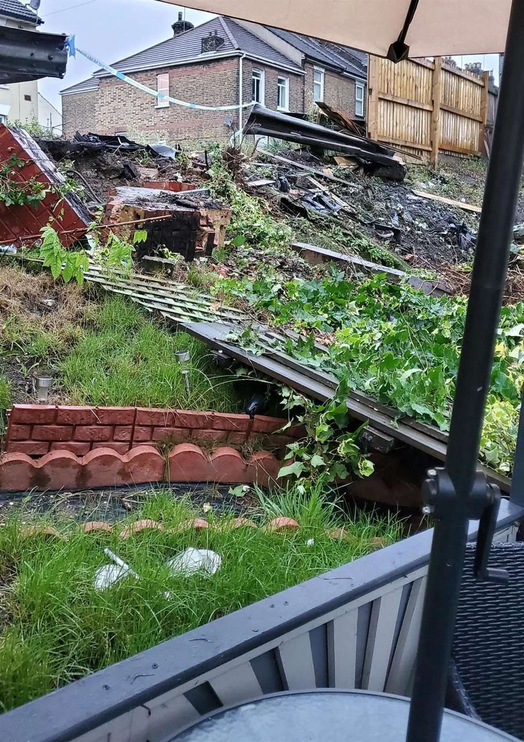 Car wrecks garden after crash