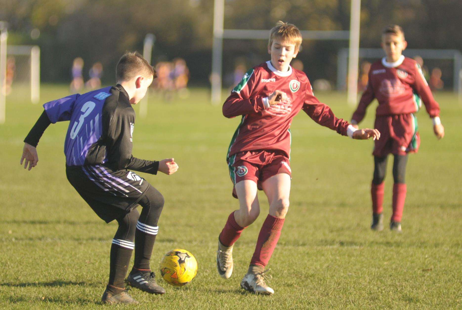 Anchorians Athletic and Cobham Colts contest the points in Under-13 Division 1 Picture: Steve Crispe