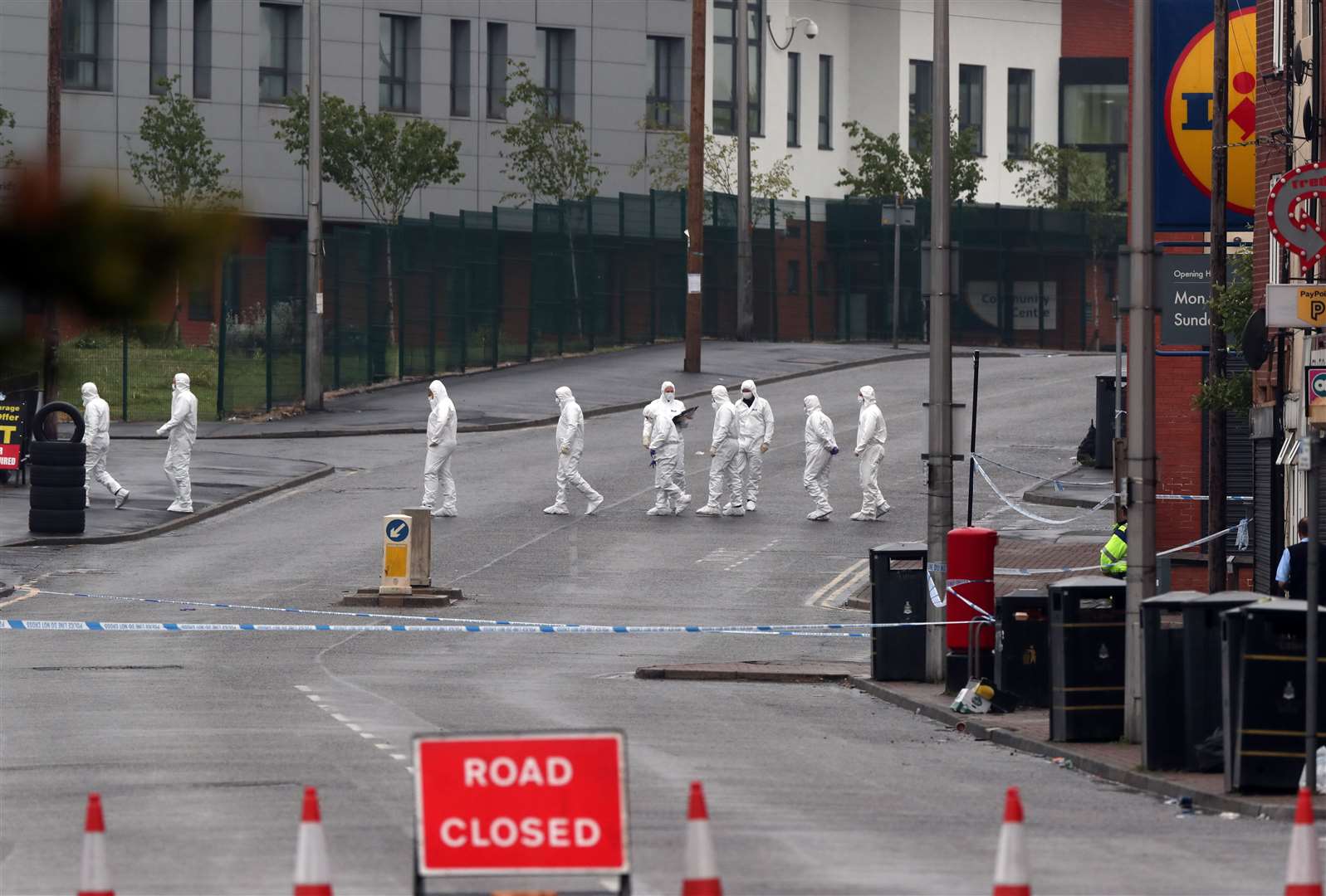 Police officers at the scene of the shooting in King Street, Blackburn (Peter Byrne/PA)