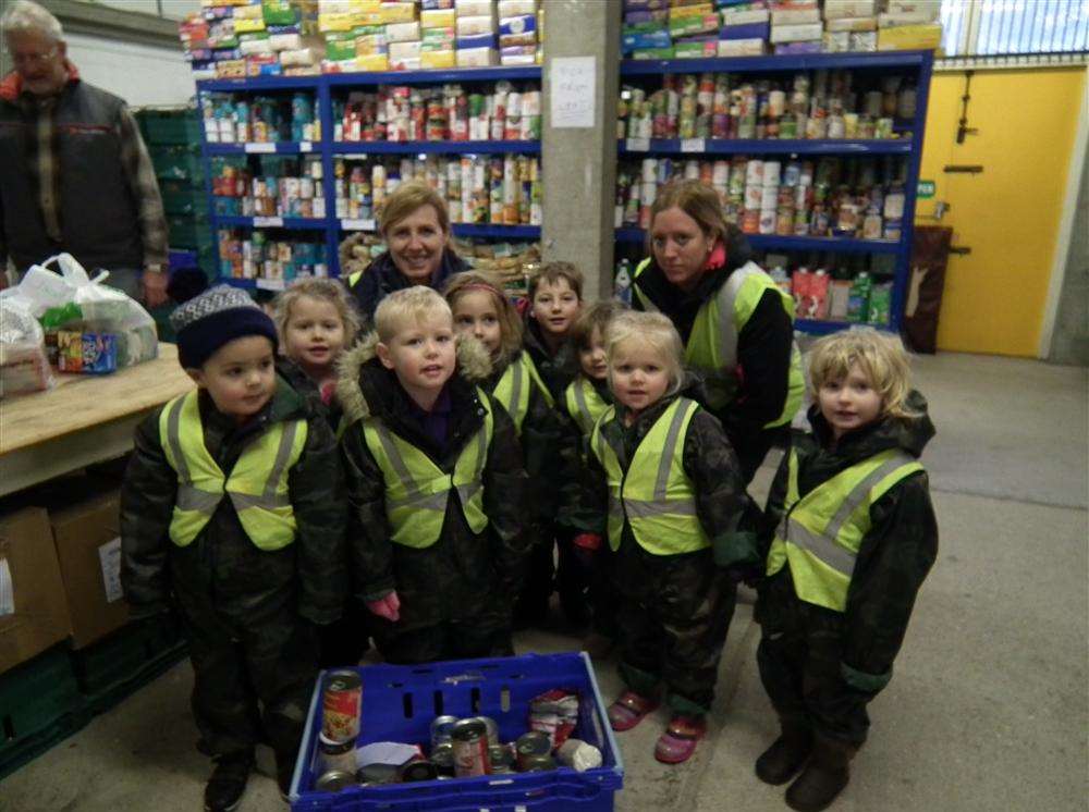 Children from Bright Sparks with their donated goods for Deal Area Emergency Foodbank