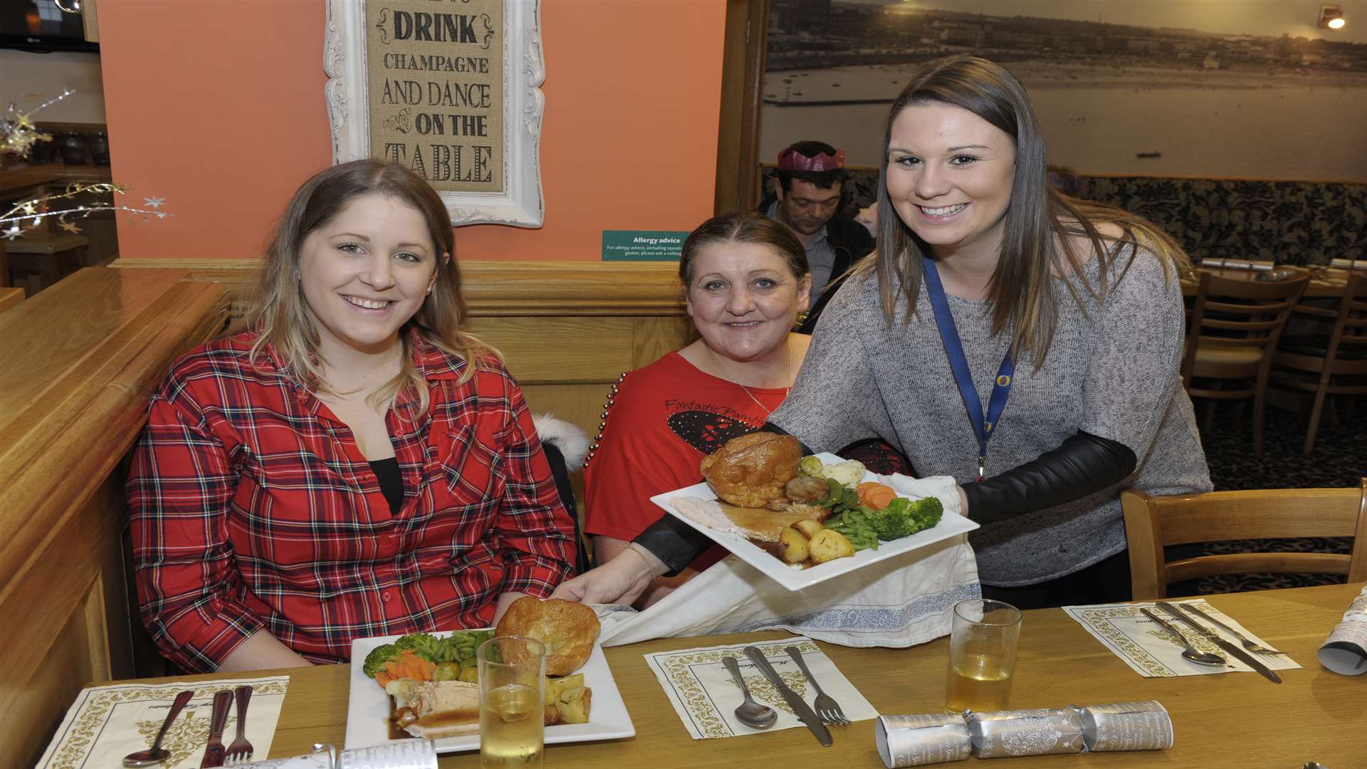 Eloise Brophy, Sue Driscle and India Blythe at The Hoy free Christmas dinner event