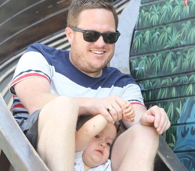 Jaymes Cadby with his son, Tate on a helter skelter