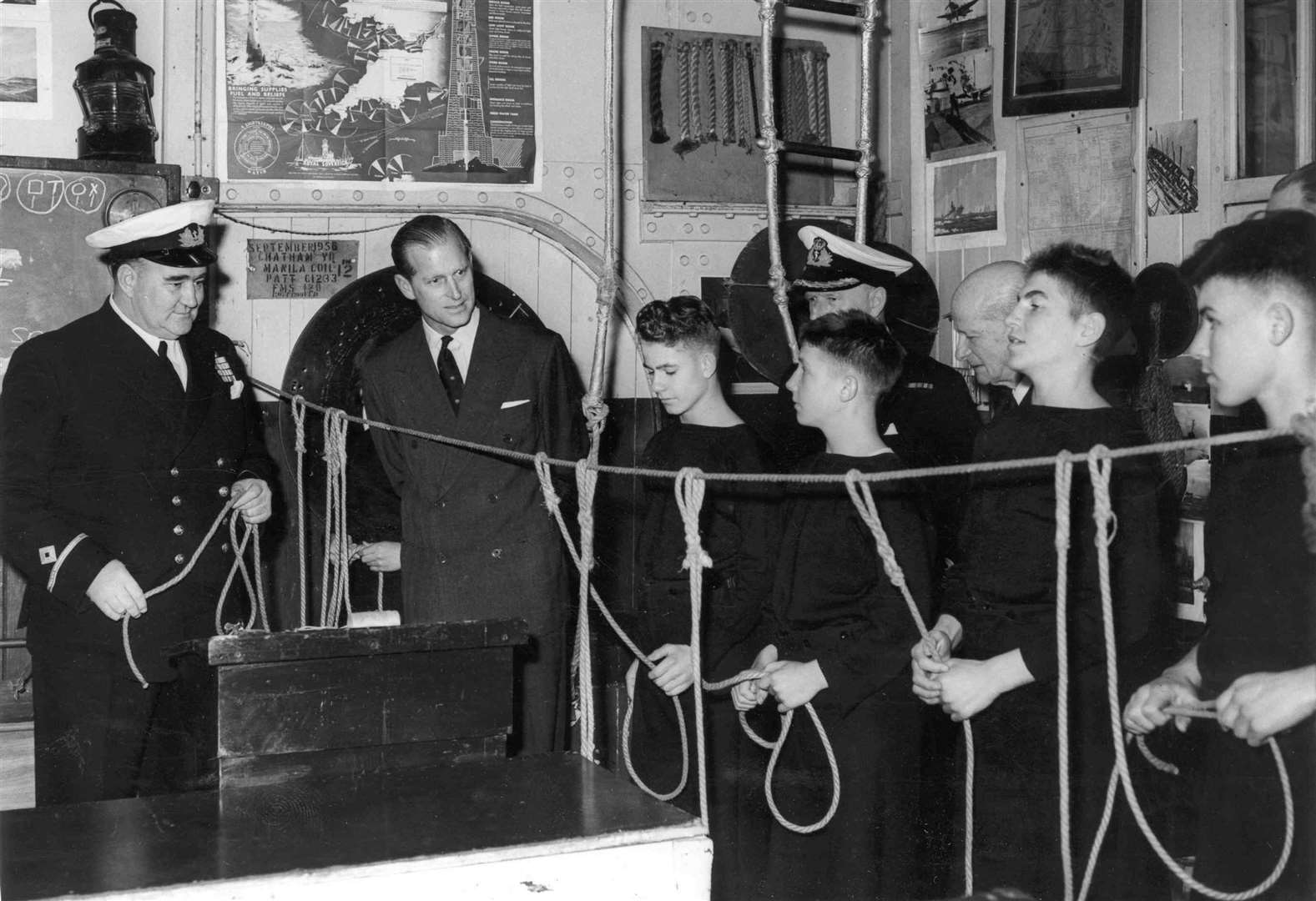 These boys demonstrated their knot-tying skills when the Duke of Edinburgh visited the training ship, Arethusa, at Upnor, near Rochester, in November 1960