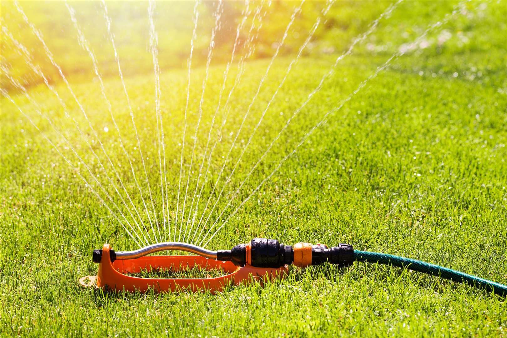 Water users are being asked to not use hoses or sprinklers. Stock image.