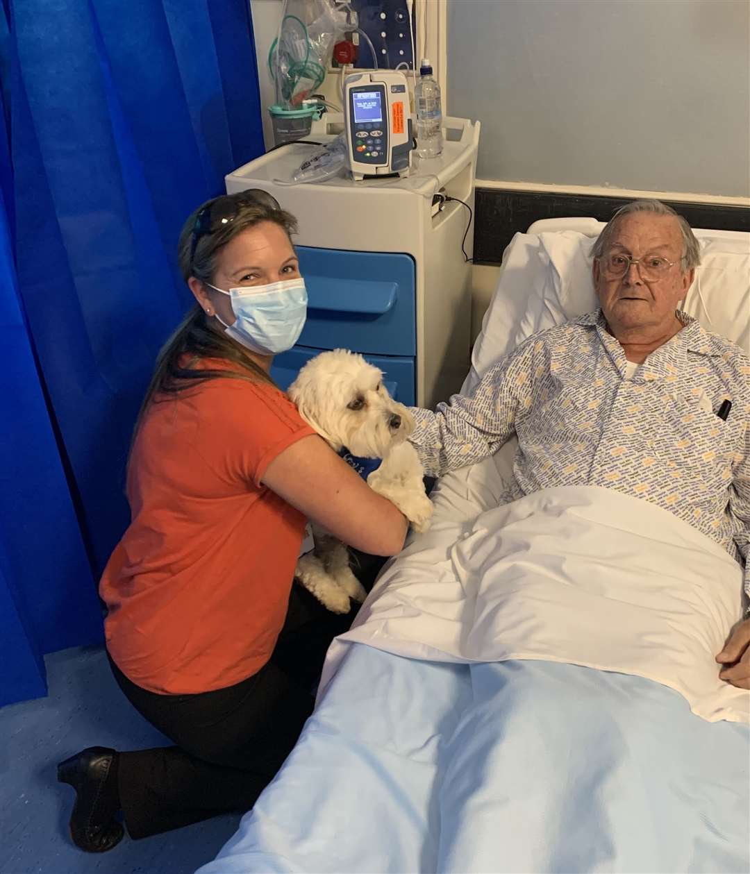 Therapy dog Fred with a patient