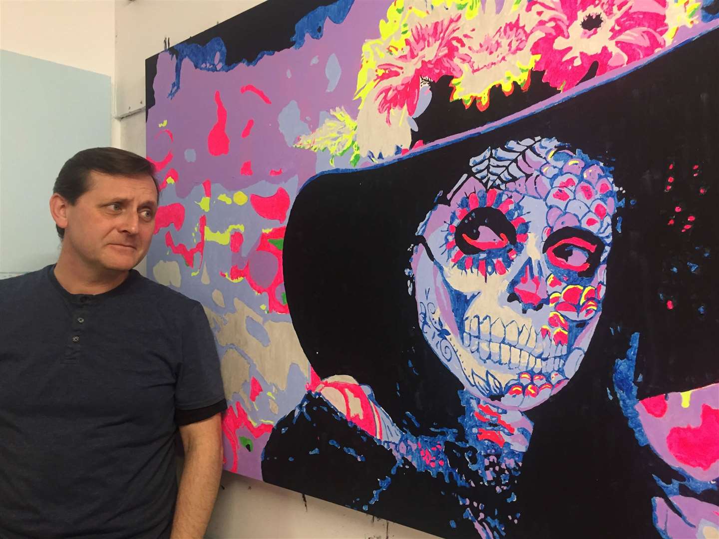 Johnathan Ash with one of his paintings