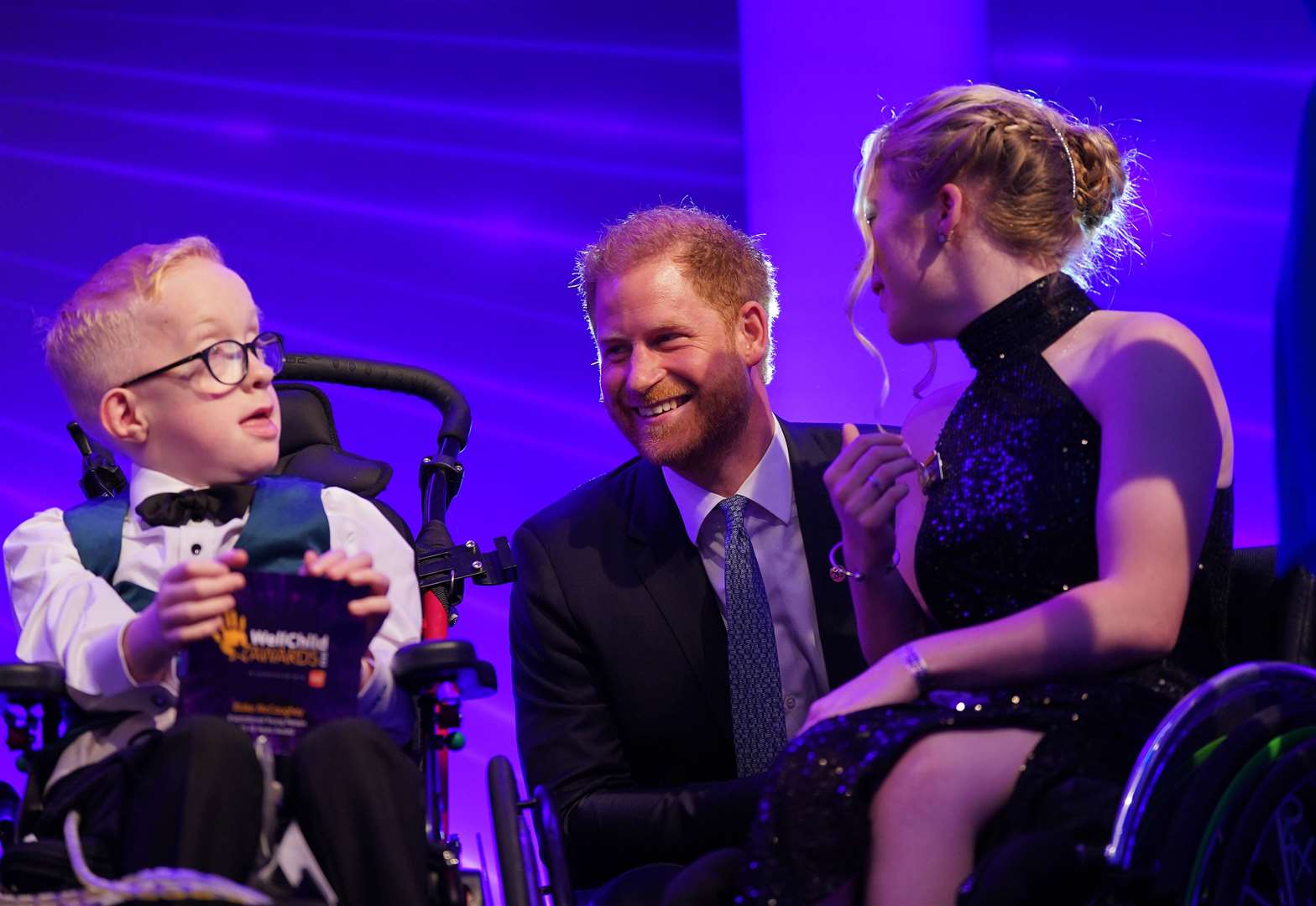 The Duke of Sussex speaks with Blake McCaughey and Hayley Cassin on stage, during the annual WellChild Awards in 2023 (Yui Mok/PA)