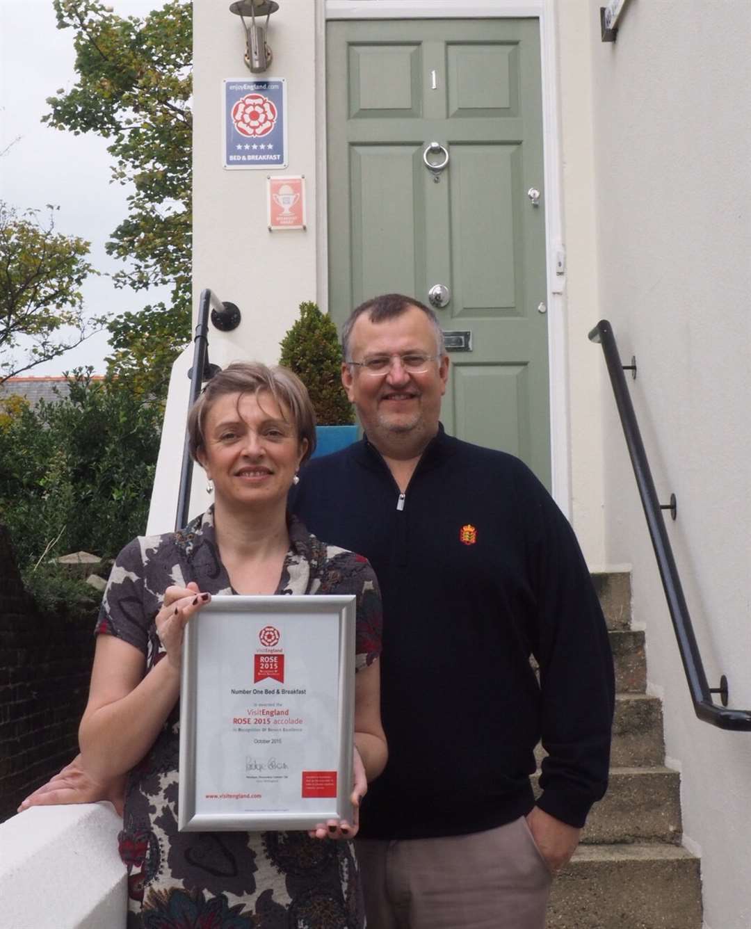 Nicky and Mark Chaplin with their Rose award certificate
