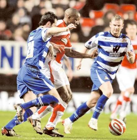 Chris Dickson tries to get between two Doncaster defenders