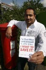 Ricky Madan, sub post master at Barming Post Office, with the petition
