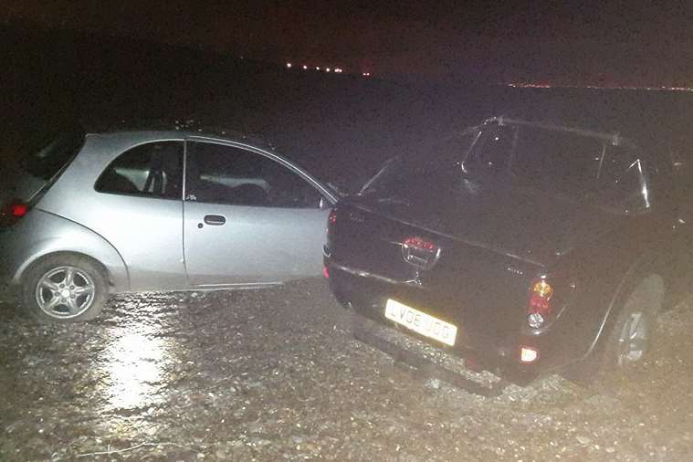 Ford car abandoned on Minster beach Friday night as the tide came in.