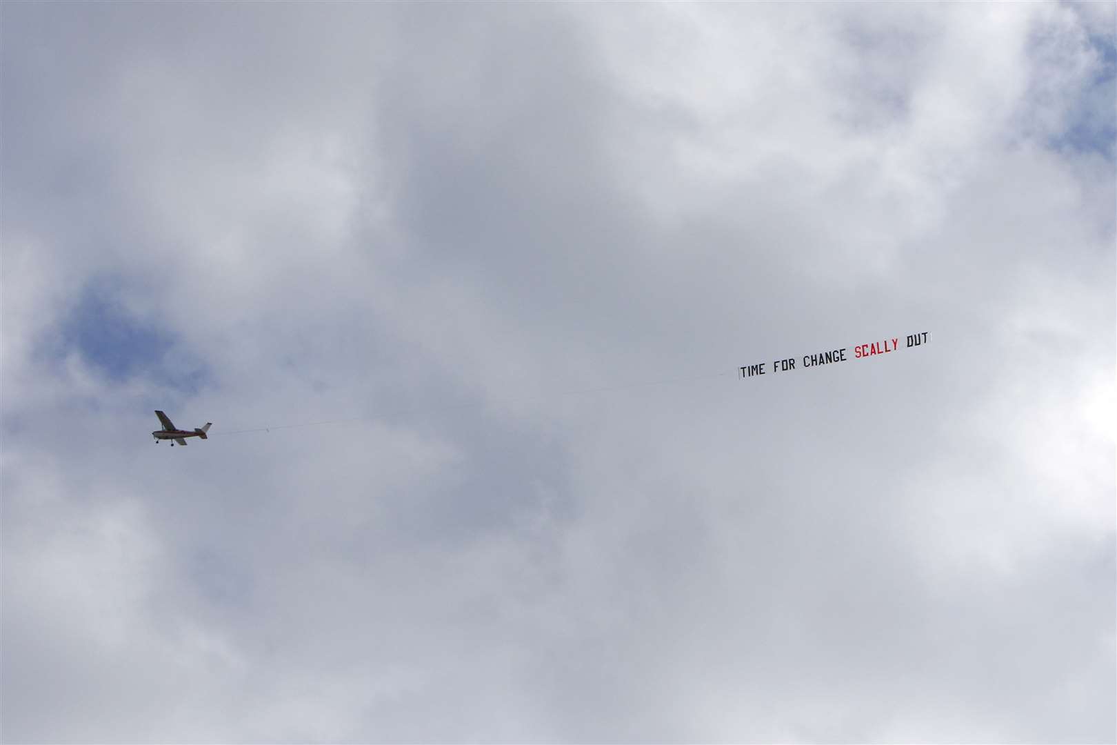 A light aircraft displaying a banner 'Time for Change Scally Out' during the first half against Sunderland Picture: Andy Jones